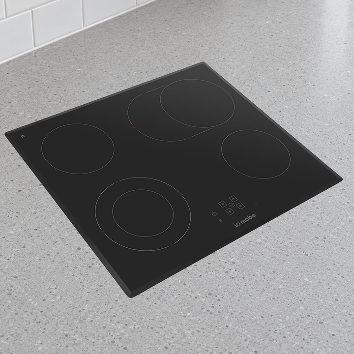 Parrilla IO Mabe IO614PVI0 en cubierta de cocina; ambiente ilustrativo con fotografía oficial del producto.